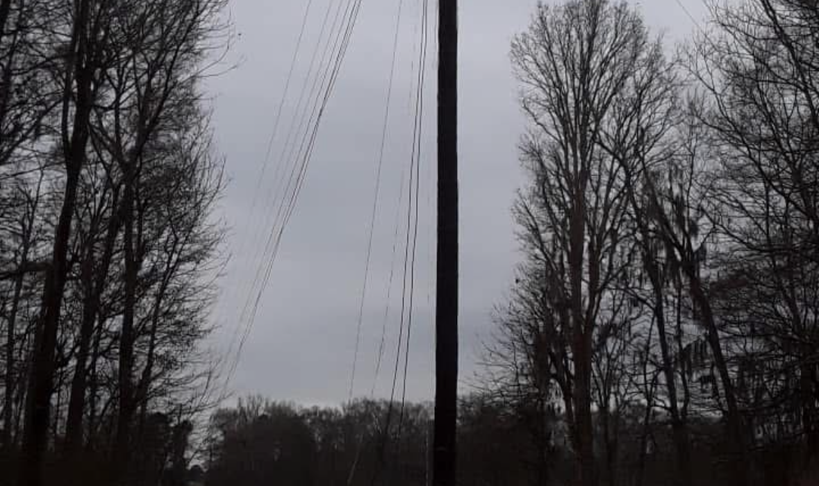 Construction worker in full PPE on a telecommunications job site